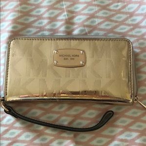 MK rose gold wristlet